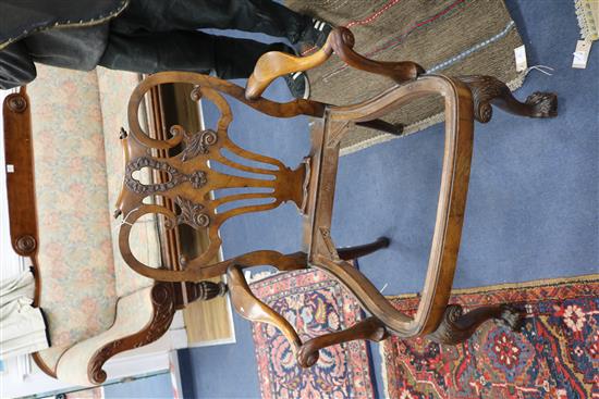 A pair of George I style walnut elbow chairs